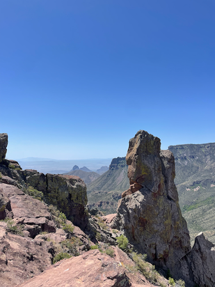 PictureID: View of rock formations and hazy mountains in the distance.